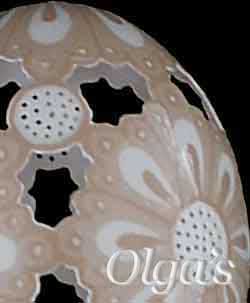 Detailed view of etched and carved brown chicken egg.