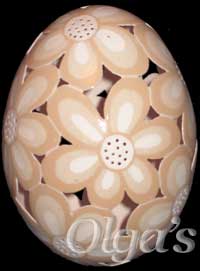 Etched and carved brown chicken egg.